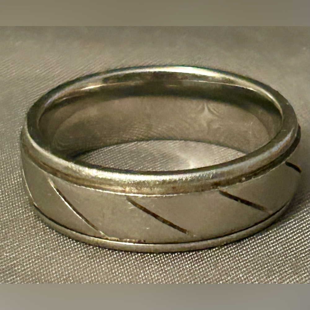 men's tungsten carbide wedding band with a diagonal cut design.